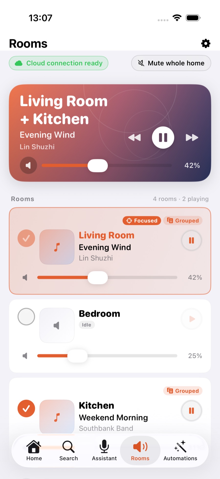 Rooms list: Living Room and Kitchen grouped and playing in sync, each room with its own volume bar
